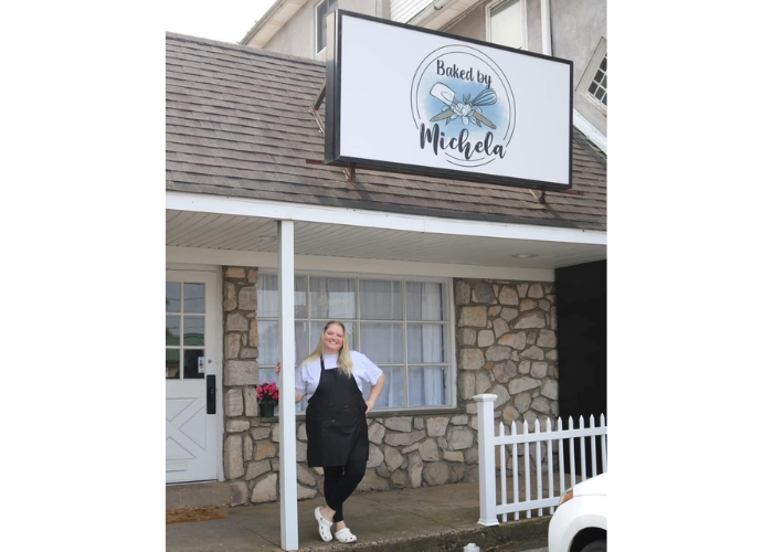 Owner of Baked by Michela and partner in front of bakery