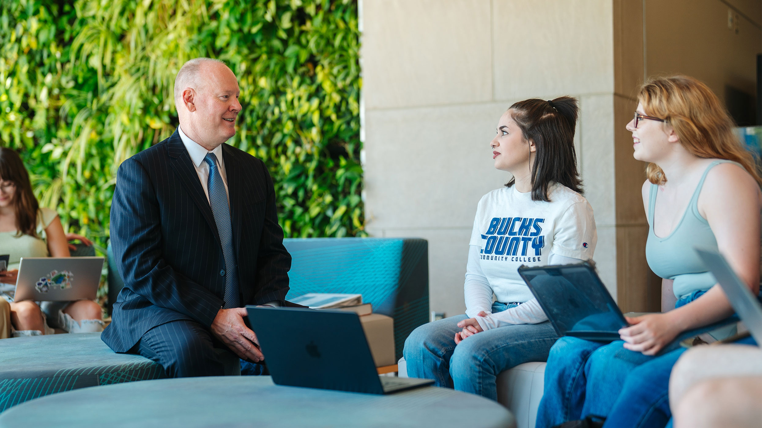 Dr. Jones speaking with female students