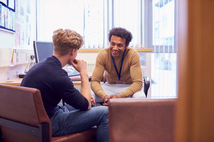 student sitting with guidance counselor